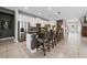 Open concept kitchen featuring an oversized island with seating and stainless steel appliances at 7702 Fairfax Dr, Kissimmee, FL 34747