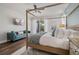 This bedroom features a four poster bed, hardwood floors and a walkout to the private patio at 7702 Fairfax Dr, Kissimmee, FL 34747