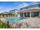 Inviting backyard pool with a spa and lounge chairs, perfect for relaxation and entertaining at 7702 Fairfax Dr, Kissimmee, FL 34747