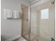 This bathroom features a glass enclosed shower with a neutral color scheme at 7702 Fairfax Dr, Kissimmee, FL 34747