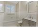 Clean and classic bathroom with a tub and shower combination, tiled walls, and a vanity at 803 E Harwood St, Orlando, FL 32803