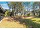 Large backyard featuring mature trees and lush grass, offering ample space at 812 2Nd St, Altamonte Springs, FL 32701