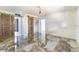 Open bedroom with polished marble floors, sliding barn doors, and ample natural light at 812 2Nd St, Altamonte Springs, FL 32701