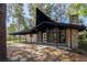 Striking mid-century modern home showcasing a unique roofline, stone chimney, and expansive windows at 812 2Nd St, Altamonte Springs, FL 32701