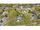 Expansive aerial view of a residential neighborhood featuring mature trees and well-maintained homes at 827 Royalwood Ln, Oviedo, FL 32765