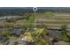 Aerial view of property with outlined border in a lush neighborhood near a field and lake at 827 Royalwood Ln, Oviedo, FL 32765