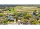 An aerial view of a single Gathering home, showing location and surrounding landscaping and neighborhood at 827 Royalwood Ln, Oviedo, FL 32765