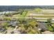 An aerial view of a single Gathering home, showing location and surrounding landscaping and neighborhood at 827 Royalwood Ln, Oviedo, FL 32765