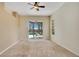 Spacious bedroom with sliding door access to the screened lanai and pool at 827 Royalwood Ln, Oviedo, FL 32765