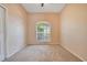 Cozy bedroom with neutral carpet and a large window letting in ample natural light at 827 Royalwood Ln, Oviedo, FL 32765