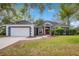 Charming single-Gathering home featuring a well-manicured lawn and a classic color scheme at 827 Royalwood Ln, Oviedo, FL 32765