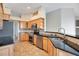 Modern kitchen with stainless steel appliances and granite countertops at 827 Royalwood Ln, Oviedo, FL 32765