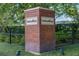 Brick pillar entrance to Oakland Park community featuring manicured greenery at 932 Kylee Aly, Winter Garden, FL 34787