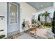 Charming front porch with rocking chairs, plants, a welcome mat, and a view of the neighborhood at 932 Kylee Aly, Winter Garden, FL 34787