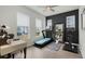 Inviting home gym/office space with a treadmill, desk and contemporary design at 932 Kylee Aly, Winter Garden, FL 34787