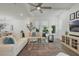 Open-concept living room boasts natural light, a comfortable sectional, and modern decor at 932 Kylee Aly, Winter Garden, FL 34787