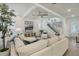 Bright living room featuring modern furniture, a stylish ceiling fan and an adjacent staircase at 932 Kylee Aly, Winter Garden, FL 34787