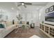 Inviting living room featuring an area rug, neutral tones and an open concept design at 932 Kylee Aly, Winter Garden, FL 34787