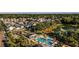 Aerial view of a charming neighborhood featuring a pool, lake, green spaces and various home styles at 932 Kylee Aly, Winter Garden, FL 34787