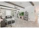 Bright living room with gray sofas, stylish decor, and a sliding glass door to the backyard at 10267 Authors Way, Orlando, FL 32832