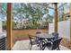 Backyard patio with outdoor table and chairs, offering a relaxing space with scenic views at 1027 Park Ridge Cir, Kissimmee, FL 34746