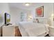 Inviting bedroom with a queen bed, soft bedding, a TV and a bright window at 1027 Park Ridge Cir, Kissimmee, FL 34746