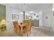 Bright dining area with view to the kitchen and natural light at 1027 Park Ridge Cir, Kissimmee, FL 34746