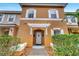 Charming two-story condo with white shutters and landscaped front yard at 1027 Park Ridge Cir, Kissimmee, FL 34746