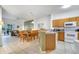 Bright living room with tile flooring, dining area, and access to the patio at 1027 Park Ridge Cir, Kissimmee, FL 34746