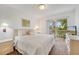 Serene bedroom with balcony access and neutral decor at 1027 Park Ridge Cir, Kissimmee, FL 34746