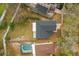Aerial view of the house featuring a large backyard and a screened in pool at 1063 Eagles Forrest, Apopka, FL 32712