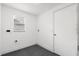 Modern bathroom with glass-enclosed shower and convenient open shelving for storage at 1063 Eagles Forrest, Apopka, FL 32712