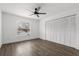 Bedroom features include wood-look flooring, window views and a large closet at 1063 Eagles Forrest, Apopka, FL 32712