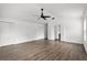 Large main bedroom boasts wood floors, ceiling fan and multiple closets at 1063 Eagles Forrest, Apopka, FL 32712