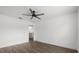 A bedroom showcasing hardwood flooring, a ceiling fan, and doorway at 1063 Eagles Forrest, Apopka, FL 32712