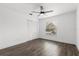 Bright bedroom with hardwood flooring, a ceiling fan, closet, and window at 1063 Eagles Forrest, Apopka, FL 32712