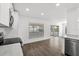 Modern kitchen featuring white cabinets, stainless appliances, recessed lighting, and sliding door to lanai at 1063 Eagles Forrest, Apopka, FL 32712