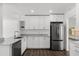 Beautiful kitchen with white cabinets, stainless steel appliances, and bright natural light at 1063 Eagles Forrest, Apopka, FL 32712