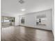 Sun-filled living room boasts wood-look floors, sliding door access to lanai and bright ambiance at 1063 Eagles Forrest, Apopka, FL 32712
