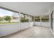 Relaxing screened porch with tiled flooring and bright, airy feel at 1063 Eagles Forrest, Apopka, FL 32712