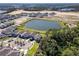 Expansive aerial view of a modern community with new construction, lakes, parks and walking trails at 11206 Pixie Mandarin Ct, Winter Garden, FL 34787
