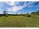 Expansive backyard featuring a well-maintained lawn, mature trees, and a picturesque view at 11206 Pixie Mandarin Ct, Winter Garden, FL 34787