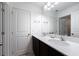 Stylish bathroom showcasing double sinks with quartz countertops and sleek fixtures at 11206 Pixie Mandarin Ct, Winter Garden, FL 34787