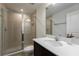 Updated bathroom featuring a glass-enclosed shower, quartz countertop, and modern fixtures at 11206 Pixie Mandarin Ct, Winter Garden, FL 34787