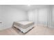 Minimalist bedroom creating a tranquil retreat with neutral tones, carpet floors, and simple furnishings at 11206 Pixie Mandarin Ct, Winter Garden, FL 34787