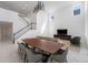Elegant open-concept living and dining area with sleek furniture and a modern chandelier at 11206 Pixie Mandarin Ct, Winter Garden, FL 34787