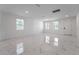 Bright living space with large windows, marble floors, and recessed lighting, perfect for entertaining and relaxation at 11206 Pixie Mandarin Ct, Winter Garden, FL 34787