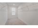 Organized walk-in closet with ample shelving, providing efficient storage and maximizing space utilization at 11206 Pixie Mandarin Ct, Winter Garden, FL 34787