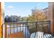 Balcony view of a community lagoon and pool area with blue skies and patio furniture at 12521 Floridays Resort Dr # 307F, Orlando, FL 32821