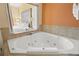 This bathroom has a luxurious jacuzzi tub for relaxing after a long day of sightseeing at 12521 Floridays Resort Dr # 307F, Orlando, FL 32821